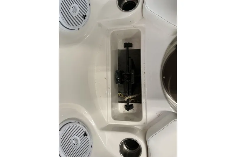 Slide: The Image of 2008 Rinker 226 Captiva Bowrider interior with speakers and storage compartment. - 30