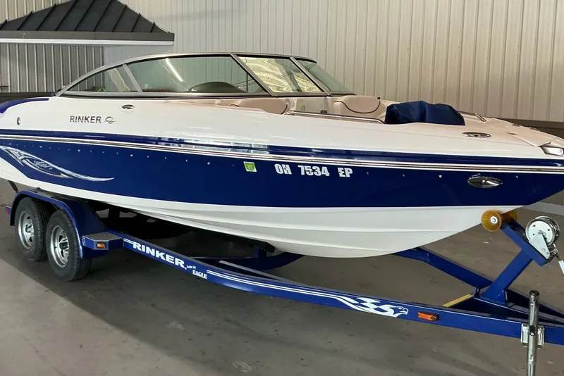 Slide: The Image of 2008 Rinker 226 Captiva Bowrider on trailer in indoor storage facility. - 6