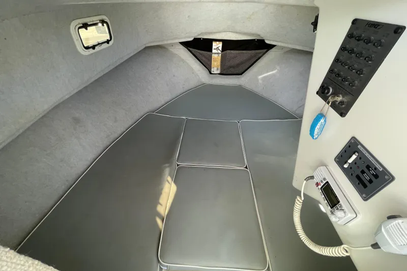 Slide: The Image of Interior cabin of 2016 Parker 2510 XL Walkaround boat with control panel. - 14