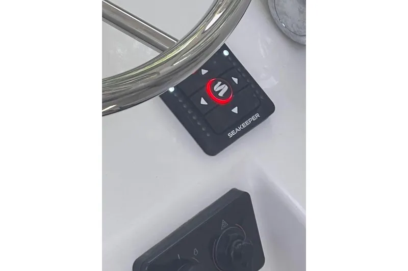 Slide: The Image of Control panel of a 2016 Parker 2510 XL Walkaround boat with Seakeeper system. - 16