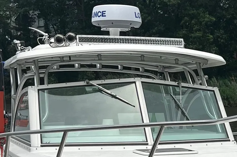 Slide: The Image of 2016 Parker 2510 XL Walkaround boat with radar and windshield wipers. - 3