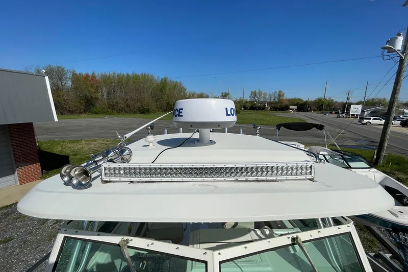 Slide: The Image of 2016 Parker 2510 XL Walkaround boat with radar and light bar on deck. - 4