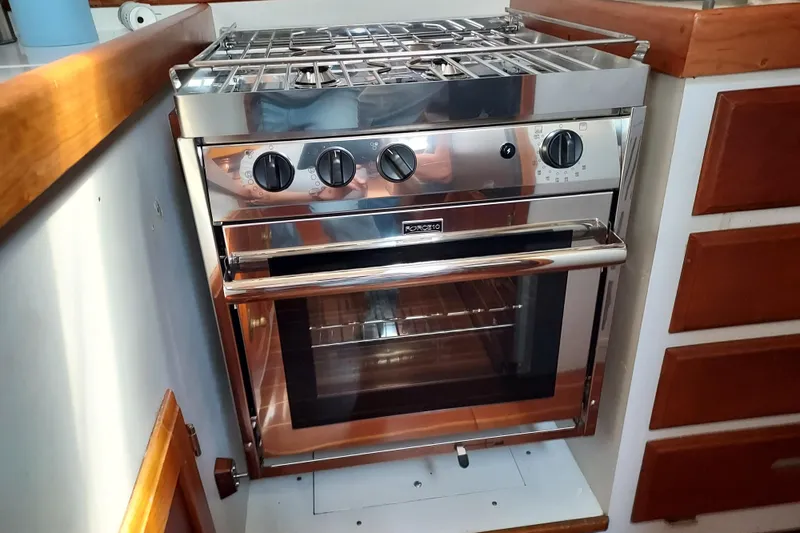 Slide: The Image of Stainless steel stove and oven in a 1983 Durbeck 50 yacht kitchen. - 12