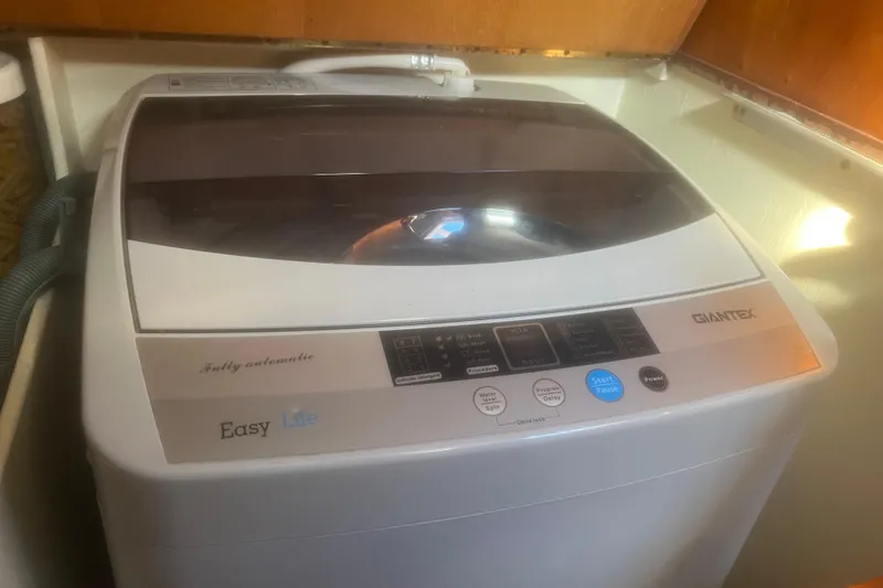 Slide: The Image of Fully automatic Giantex washing machine in a Durbeck 50, 1983 model boat interior. - 24