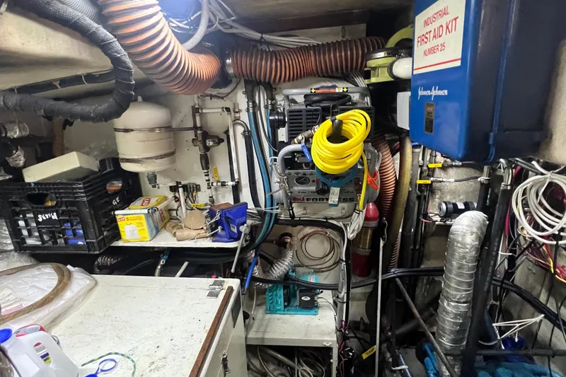 Slide: The Image of Engine room of a 1983 Durbeck 50 boat with equipment and first aid kit. - 29