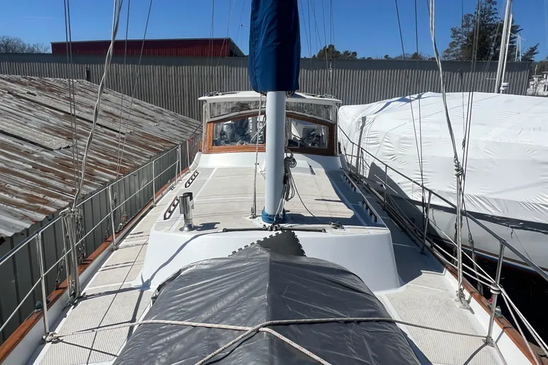 Slide: The Image of 1983 Durbeck 50 sailboat docked, covered, and ready for maintenance. - 41