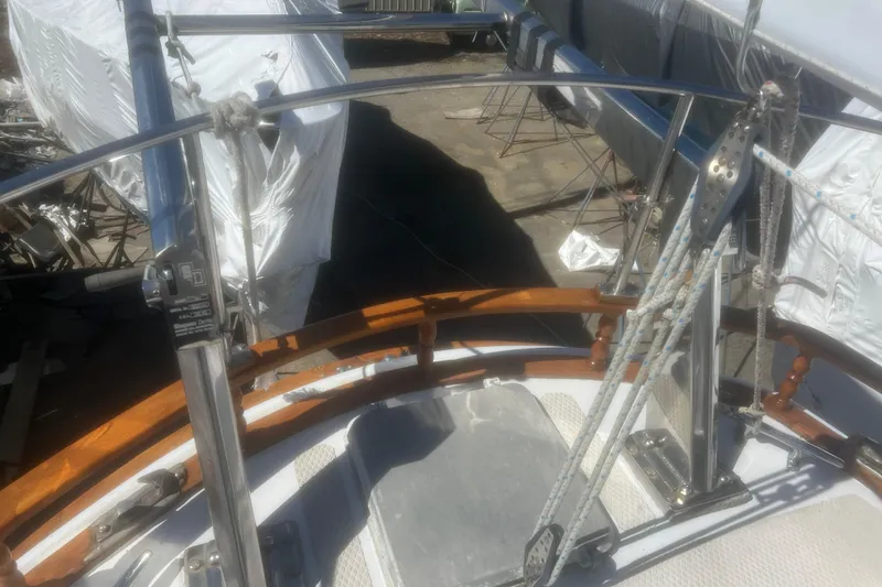 Slide: The Image of Deck view of a 1983 Durbeck 50 sailboat with rigging and wooden railings. - 47