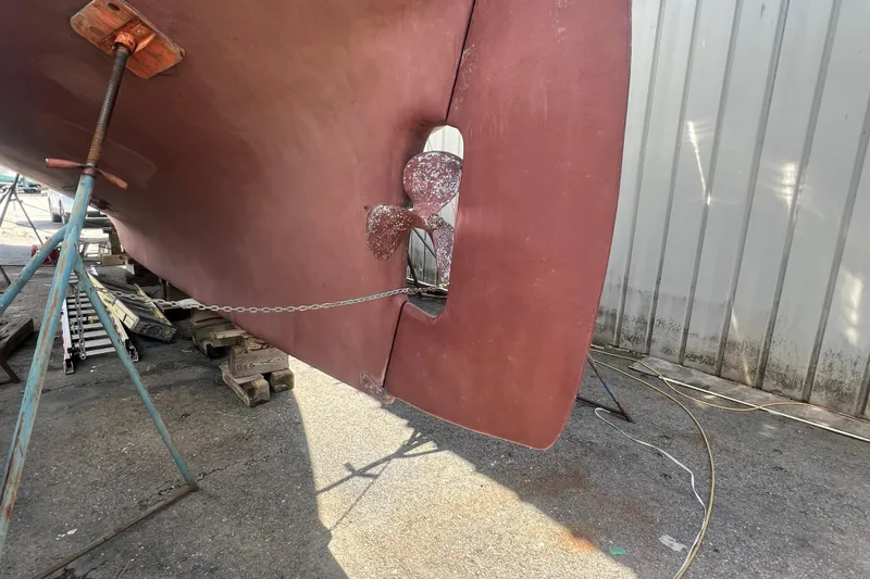 Slide: The Image of Bottom view of a 1983 Durbeck 50 sailboat with visible propeller and rudder. - 54