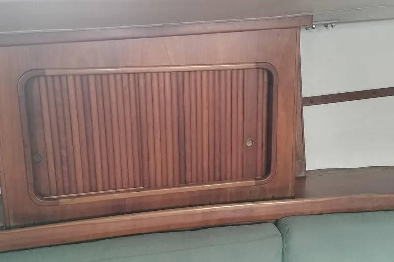 Slide: The Image of Wooden interior cabinet on a 1983 Durbeck 50 sailboat, featuring a sliding door design. - 7