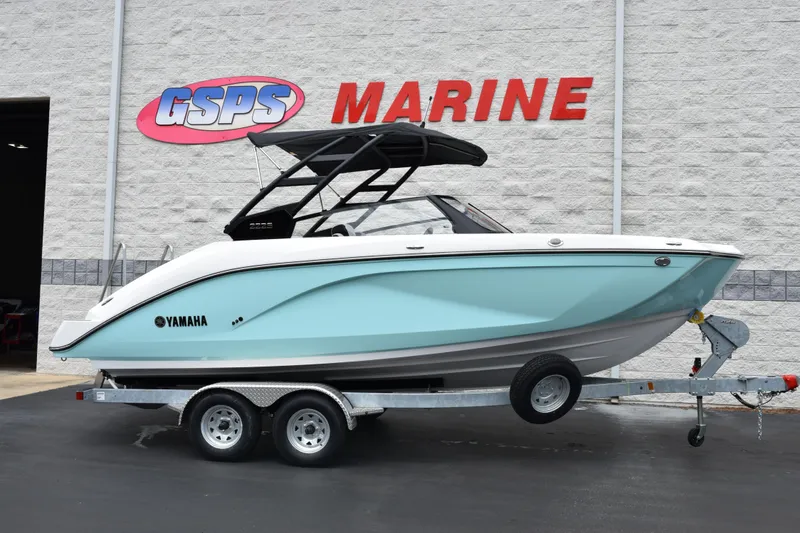 The Image of 2026 Yamaha Boats 222S in light blue on trailer at GSPS Marine dealership. - 1