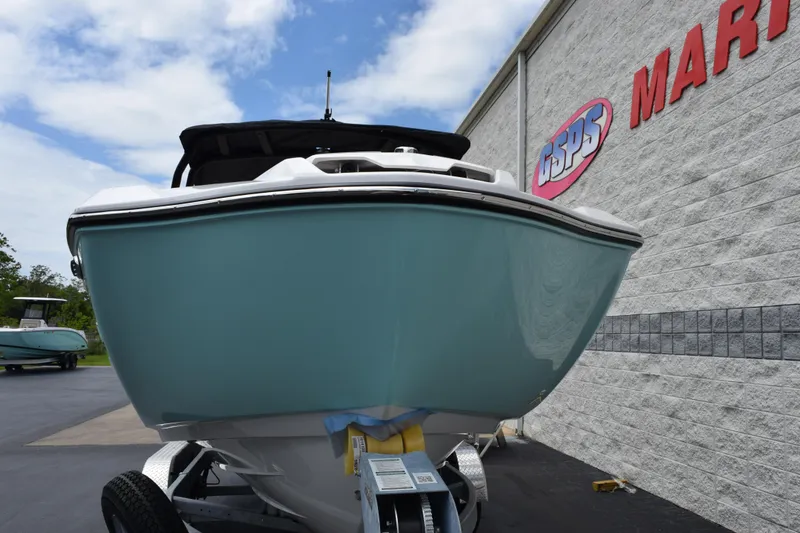 Slide: The Image of 2026 Yamaha Boats 222S displayed at a marine dealership, showcasing sleek design and modern features. - 3