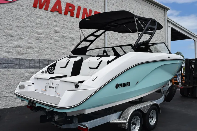 Slide: The Image of 2026 Yamaha Boats 222S on trailer, displayed outside a marine dealership. - 4