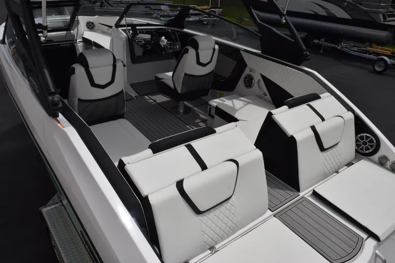 Slide: The Image of 2026 Yamaha Boats 222S interior with sleek white seating and modern dashboard design. - 6