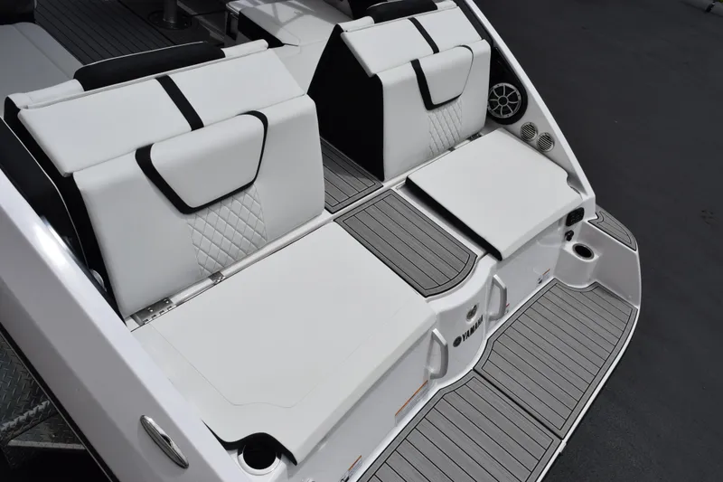 Slide: The Image of 2026 Yamaha Boats 222S swim platform with cushioned seating and sleek design. - 7