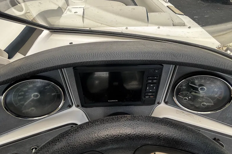 Slide: The Image of Dashboard of a 2022 Hurricane SunDeck 217 OB boat with Garmin display and gauges. - 11