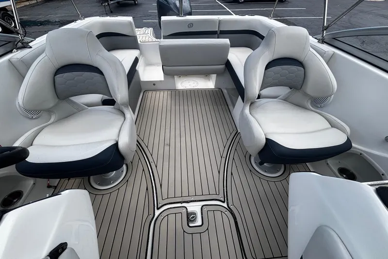 Slide: The Image of 2022 Hurricane SunDeck 217 OB boat interior with white seating and sleek flooring. - 13