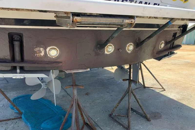 Slide: The Image of 1995 Ocean Yachts 42 Super Sport on stands, showing propellers and hull details. - 25