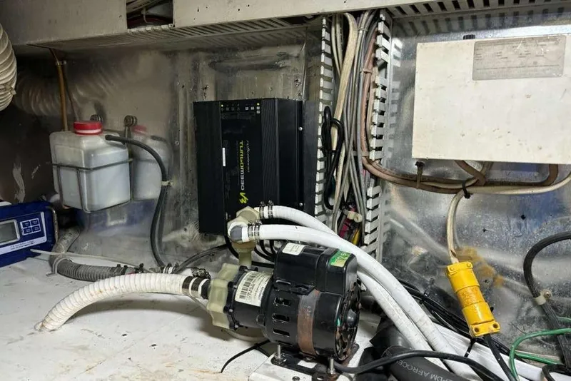 Slide: The Image of Engine room of a 1995 Ocean Yachts 42 Super Sport with wiring and equipment. - 29