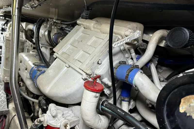 Slide: The Image of Engine compartment of a 1995 Ocean Yachts 42 Super Sport, showcasing mechanical components. - 30