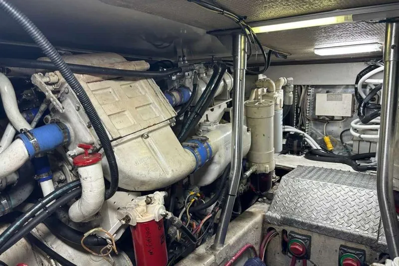 Slide: The Image of Engine room of a 1995 Ocean Yachts 42 Super Sport, showcasing mechanical components. - 31