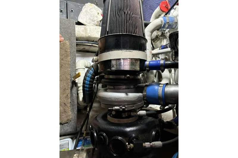 Slide: The Image of Engine compartment of a 1995 Ocean Yachts 42 Super Sport, showcasing mechanical components. - 32