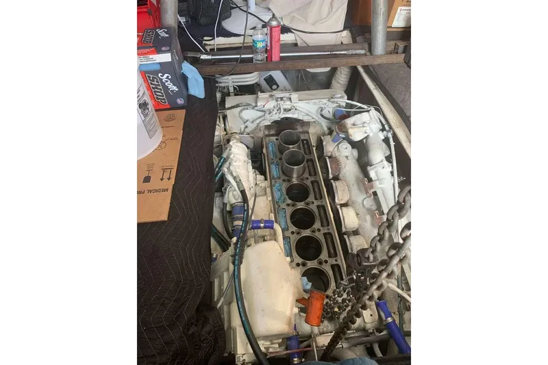 Slide: The Image of Engine compartment of a 1995 Ocean Yachts 42 Super Sport, showing detailed mechanical components. - 33