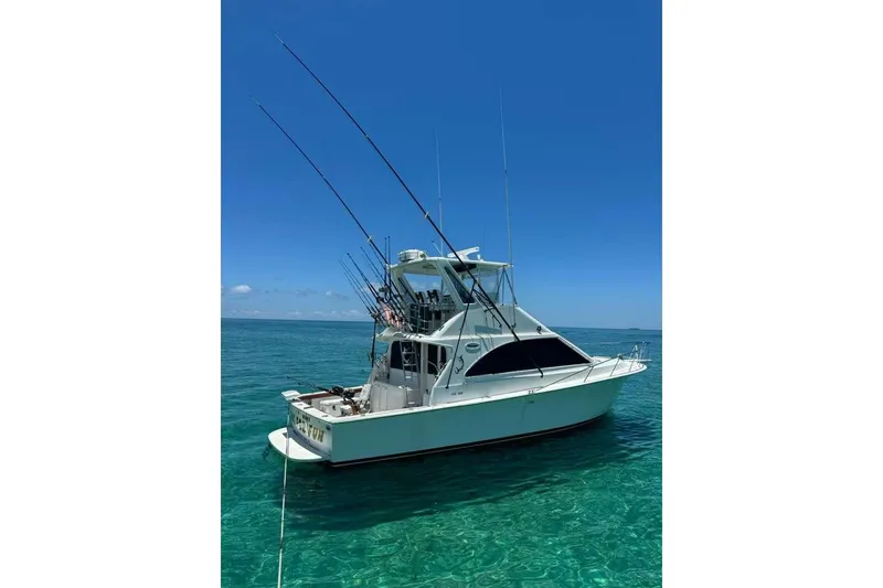 Slide: The Image of 1995 Ocean Yachts 42 Super Sport fishing boat on clear blue water. - 42