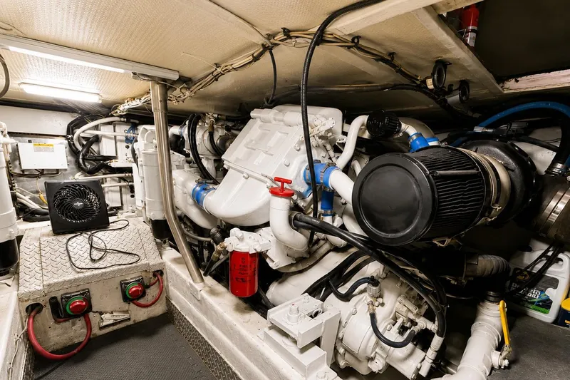 Slide: The Image of Engine room of a 1995 Ocean Yachts 42 Super Sport, showcasing mechanical components. - 51