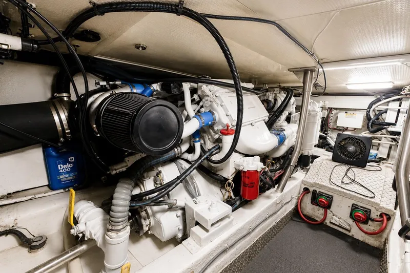 Slide: The Image of Engine room of a 1995 Ocean Yachts 42 Super Sport, showcasing mechanical components. - 52