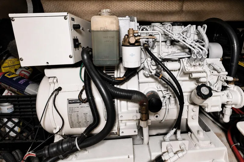 Slide: The Image of Engine room of a 1995 Ocean Yachts 42 Super Sport, showcasing detailed machinery components. - 55