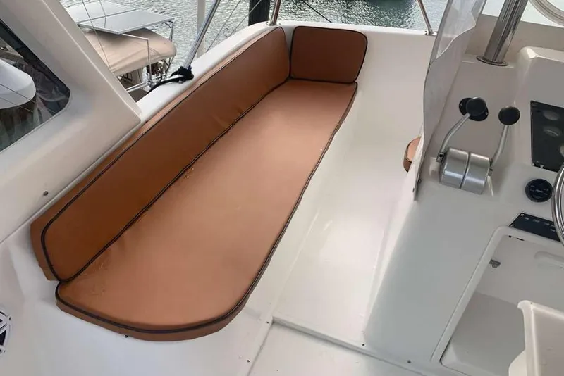 Slide: The Image of Interior view of a 1995 Ocean Yachts 42 Super Sport with tan seating and control panel. - 7