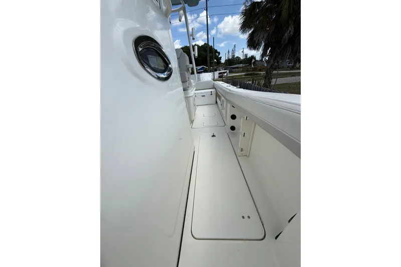Slide: The Image of 2024 World Cat 295 CC boat deck, showcasing sleek design and spacious layout. - 12