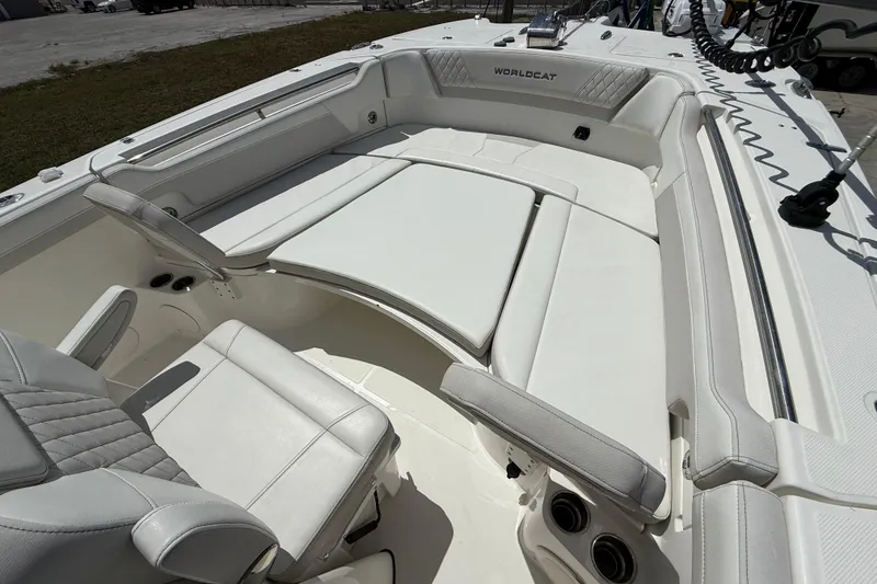Slide: The Image of 2024 World Cat 295 CC boat interior with white seating and modern design. - 19