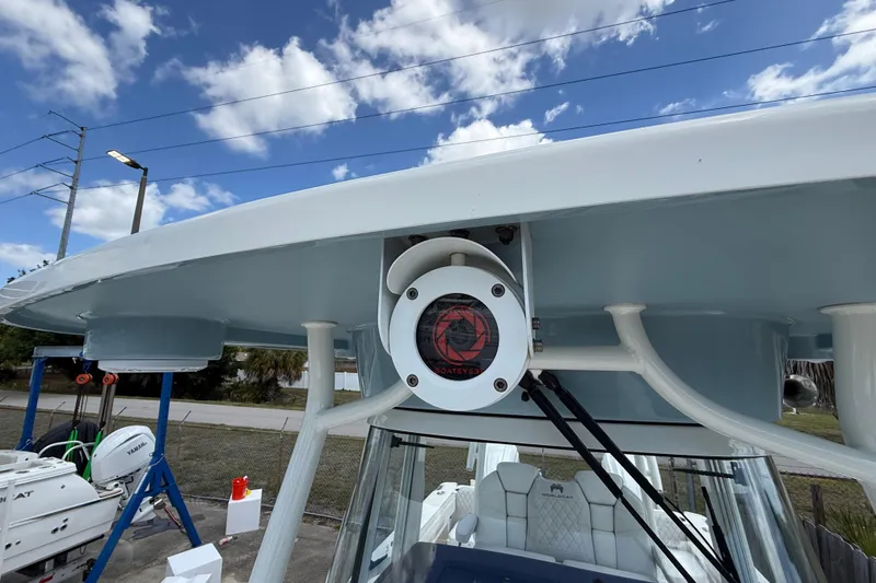 Slide: The Image of 2024 World Cat 295 CC boat with advanced radar system under a clear sky. - 21