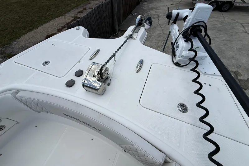 Slide: The Image of 2024 World Cat 295 CC boat deck with anchor and equipment. - 7