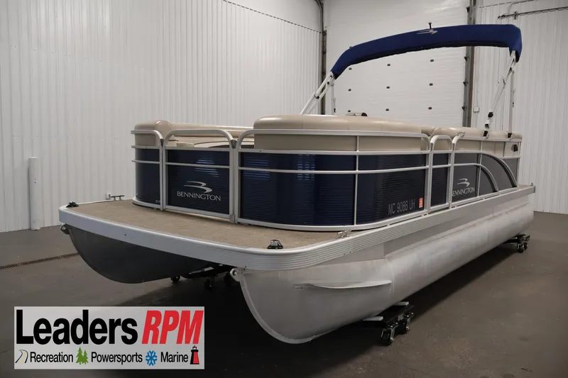 The Image of 2019 Bennington 20 SL pontoon boat with blue accents in a showroom. - 1