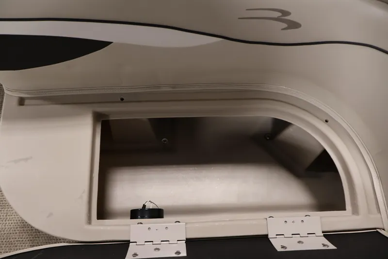 Slide: The Image of Open storage compartment in a 2019 Bennington 20 SL boat. - 14