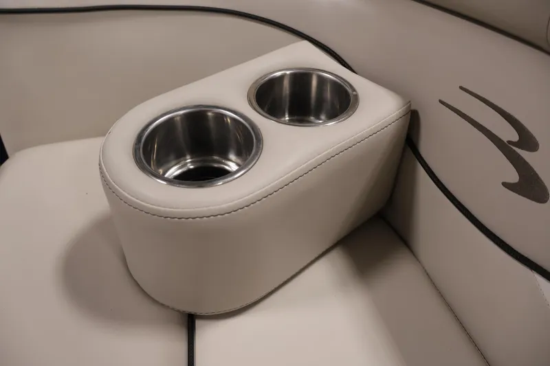 Slide: The Image of Cup holders on 2019 Bennington 20 SL boat's beige leather seating. - 16