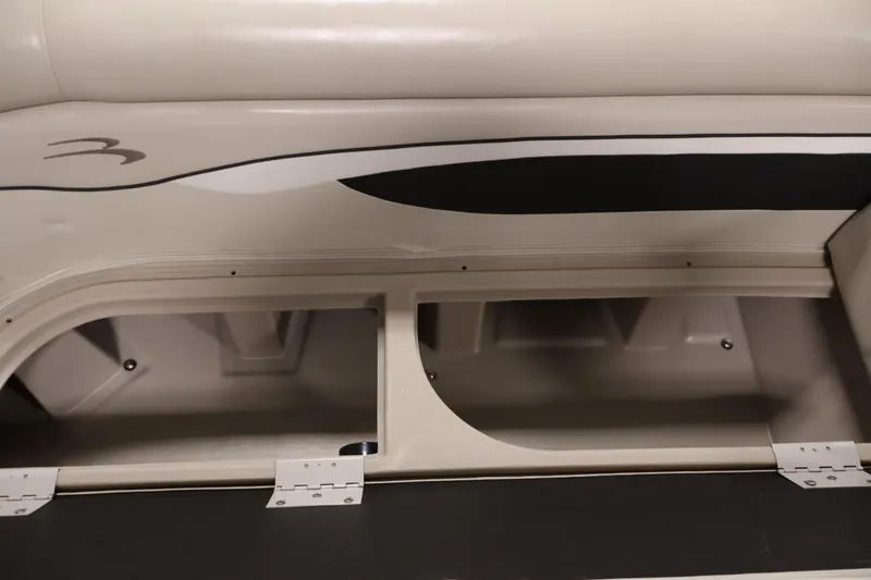 Slide: The Image of 2019 Bennington 20 SL boat interior storage compartment with beige upholstery and sleek design. - 17