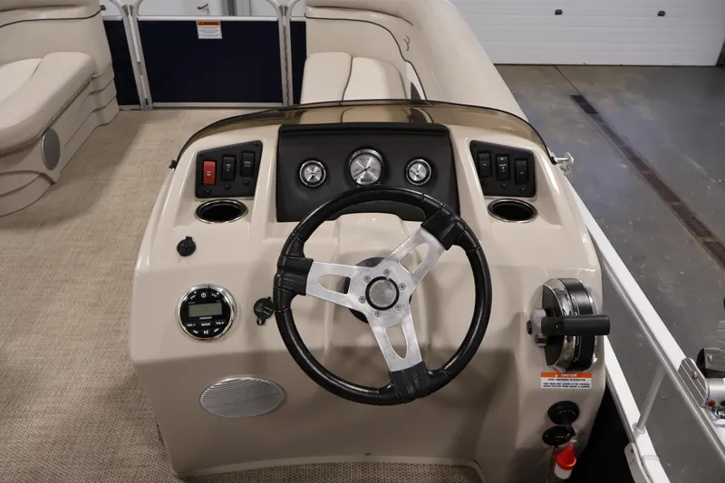 Slide: The Image of 2019 Bennington 20 SL boat dashboard with steering wheel and controls. - 20