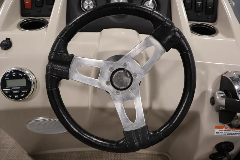 Slide: The Image of Steering wheel of a 2019 Bennington 20 SL boat with control panel. - 21