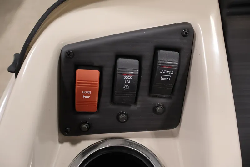 Slide: The Image of Control panel of a 2019 Bennington 20 SL boat with horn, dock lights, and livewell switches. - 23
