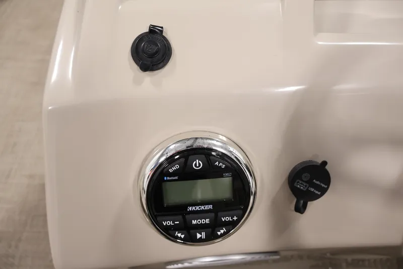 Slide: The Image of 2019 Bennington 20 SL boat dashboard with Kicker audio system and USB input. - 25