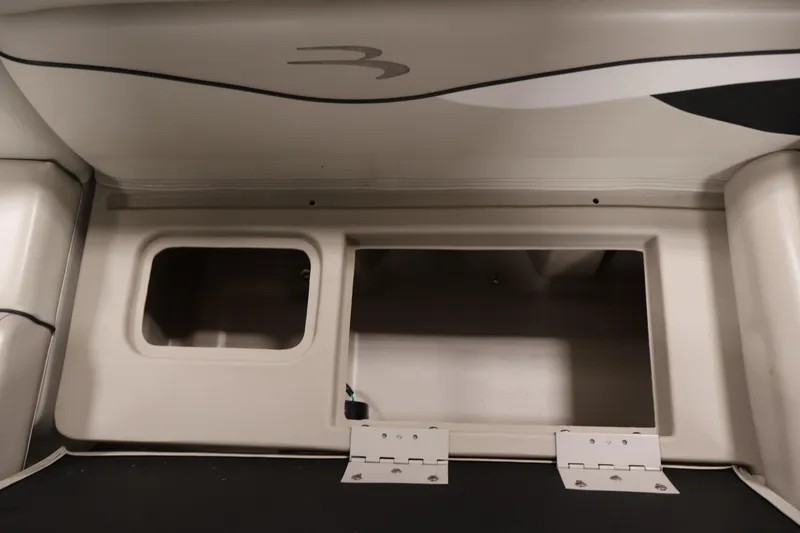 Slide: The Image of 2019 Bennington 20 SL boat storage compartments with open hatches. - 29