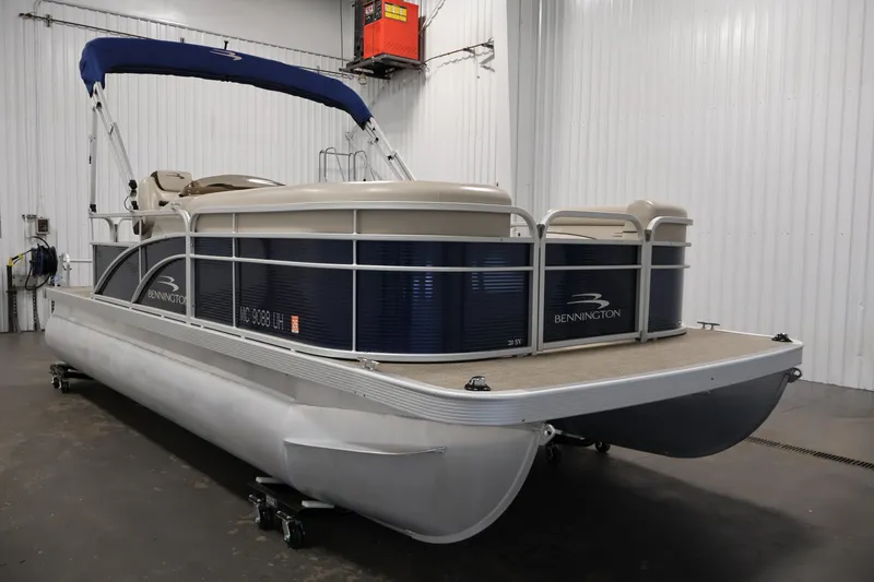Slide: The Image of 2019 Bennington 20 SL pontoon boat in indoor storage facility. - 3