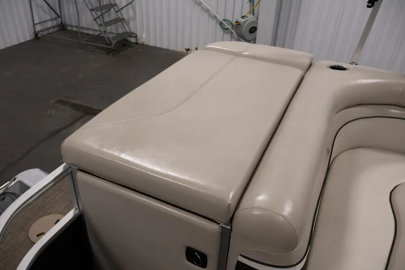 Slide: The Image of 2019 Bennington 20 SL boat with beige cushioned seating in a storage area. - 31