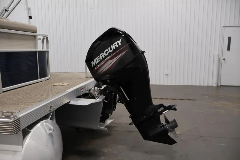 Slide: The Image of 2019 Bennington 20 SL pontoon boat with Mercury FourStroke outboard motor in a garage. - 35