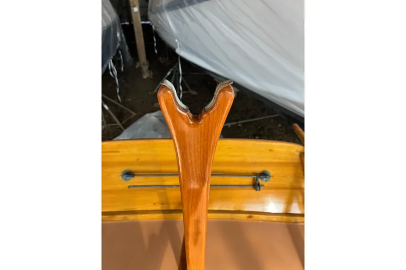 Slide: The Image of Close-up of a 1982 Herreshoff 12.5 footer's wooden tiller and cockpit detail. - 14