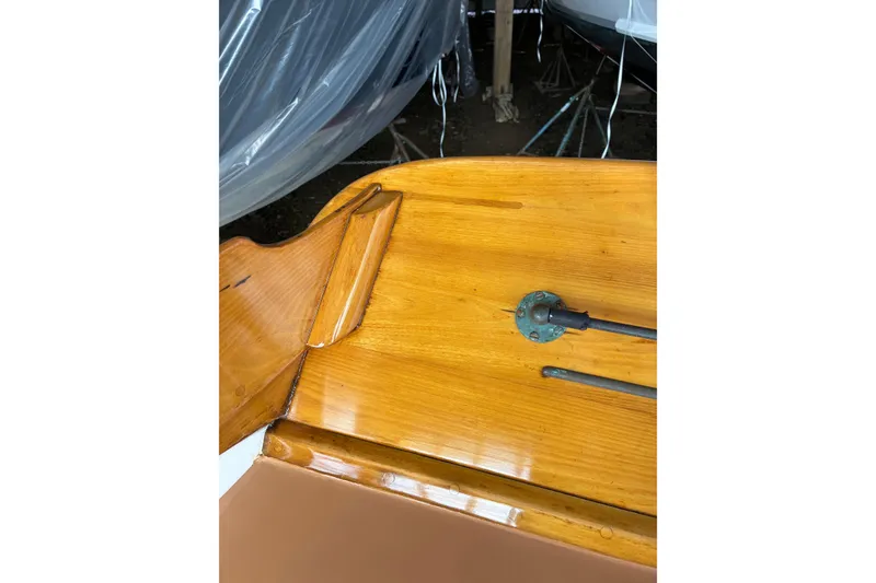 Slide: The Image of Polished wooden deck of a 1982 Herreshoff 12.5 footer sailboat. - 15