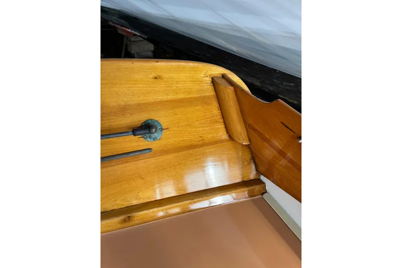 Slide: The Image of 1982 Herreshoff 12.5 footer boat interior with polished wood finish. - 16